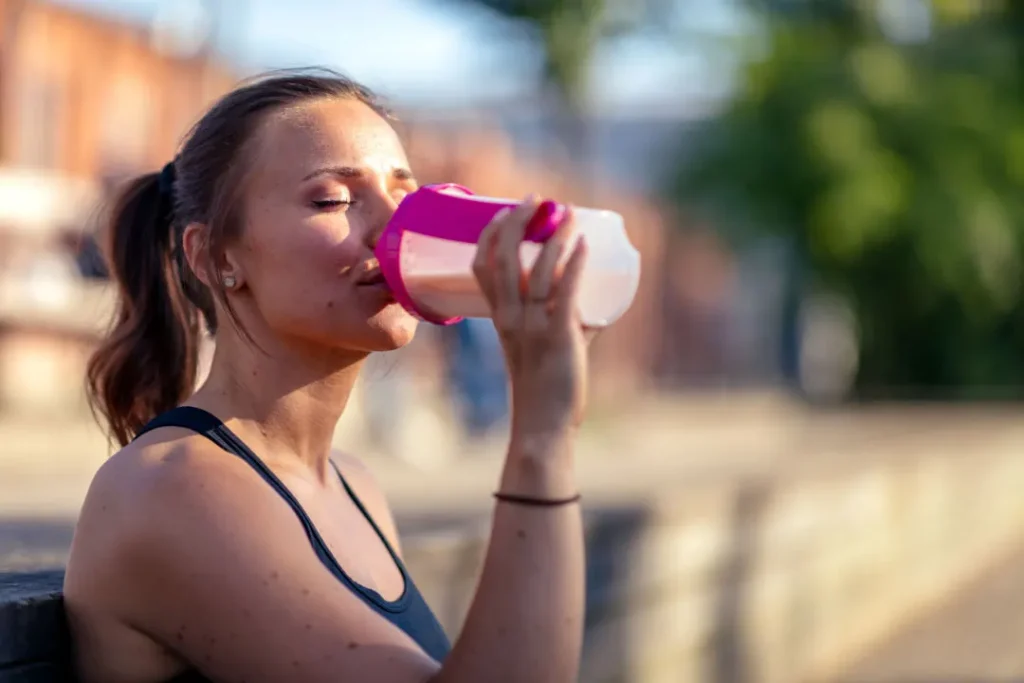 A lady drinking shake. 