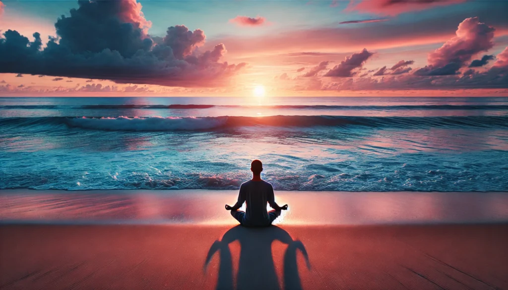 Peaceful beach meditation at sunset – A person sits in a meditative pose on a sandy beach, facing the ocean waves as the sun sets in hues of pink, orange, and blue, embodying mindfulness and emotional balance.
