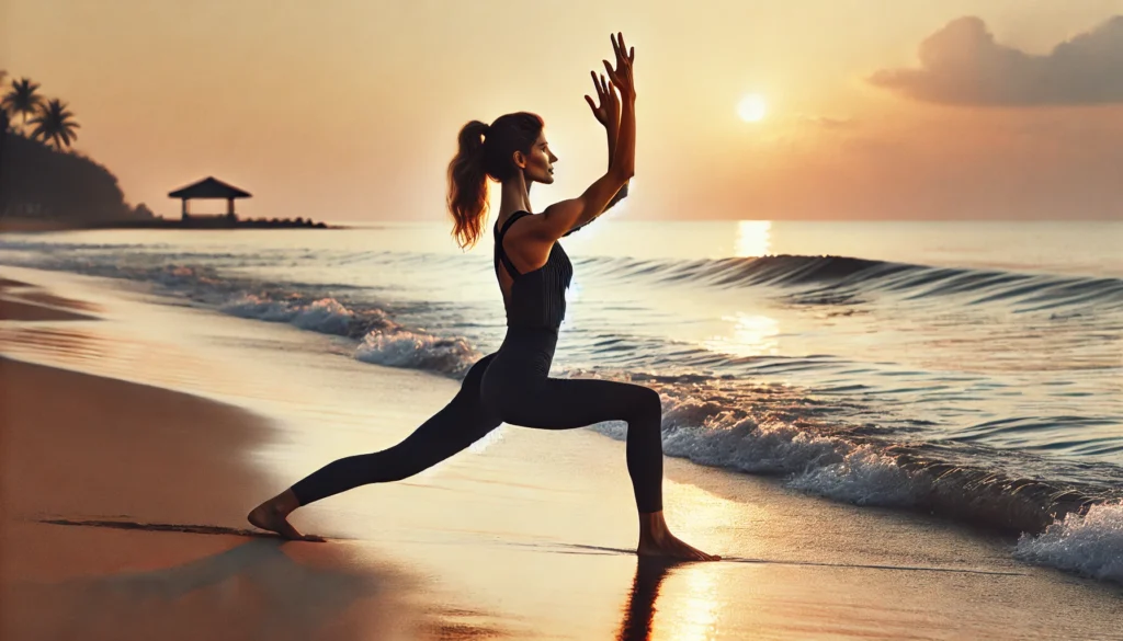 A fit woman practicing yoga-based toning exercises on a serene beach during sunrise. She is gracefully holding a warrior pose, highlighting flexibility and muscle definition with ocean waves and a peaceful sky in the background.